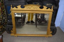 Late Victorian overmantel mirror with rectangular bevelled mirror plate set in a gilt painted frame,
