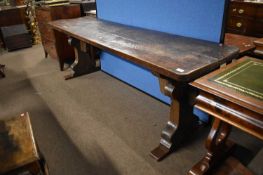 A narrow oak refectory table formed from period timbers, the top with several inset and repaired