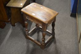An antique style oak joint stool on turned legs, 43cm wide
