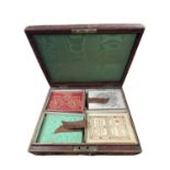 A Victorian box marked Bezique, (worn) with various cards and markers, some made by De La Rue and