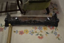 A small 19th Century cast iron fire fender with pierced decoration