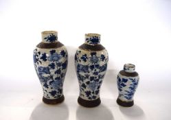 A group of three Chinese porcelain crackle ware vases, all with blue and white designs (two with rim