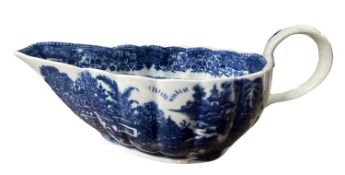 A Caughley sauce boat with blue printed argument pattern, 20cm long