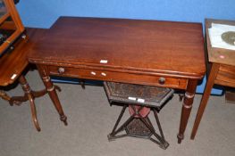 A Victorian mahogany fold top tea table with turned legs, 106cm wide