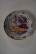 An 18th Century Chinese porcelain dish with polychrome design with shaped border, 13cm diameter