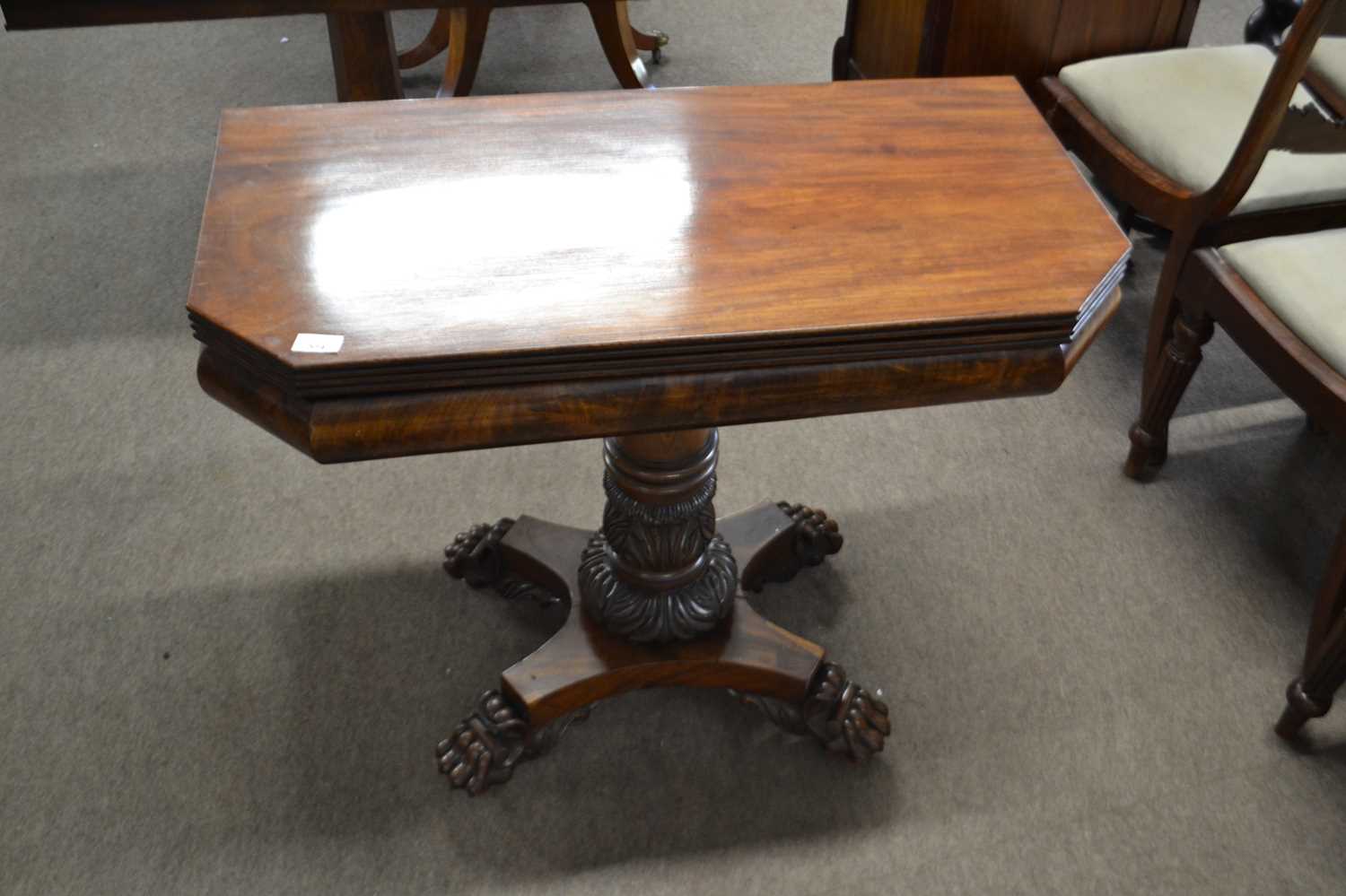 Mid 19th Century mahogany folding tea table raised on a tapering column with four carved paw feet, - Image 2 of 2