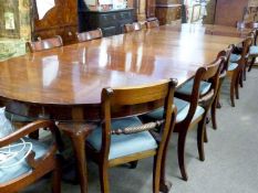 Large mahogany double D-end dining table with a central drop leaf section and two further
