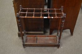 Victorian mahogany framed umbrella or stick stand with turned frame and a pull out metal drip