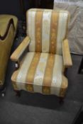 Early 20th Century beech wood framed fireside chair with striped upholstery