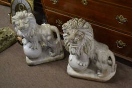 Garden Statue - Two 20th Century polished stone models of lions, resting their front feet on a