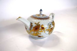 An 18th Century Chinese porcelain teapot and cover with an Imari design (chips to spout, handle