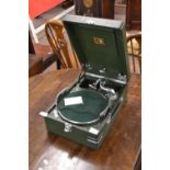 HMV portable gramophone in a green finish case The gramphone appears functional and turns when