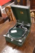 HMV portable gramophone in a green finish case The gramphone appears functional and turns when