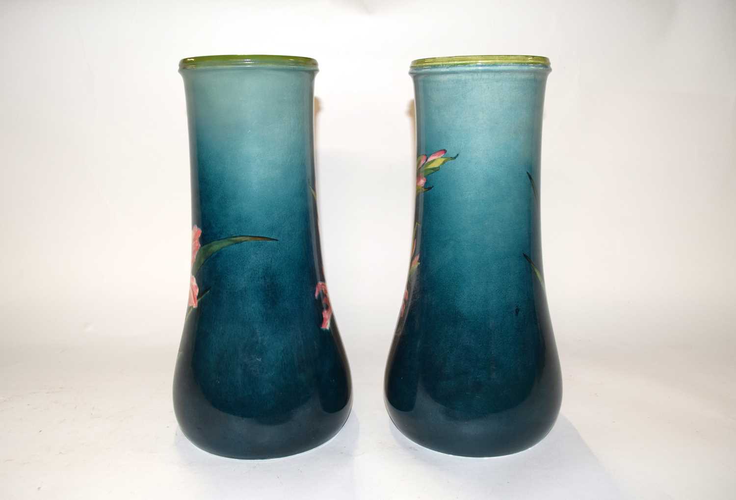 A pair of 19th Century Lambeth Faience vases decorated with pink flowers on green ground by Katie - Image 3 of 3