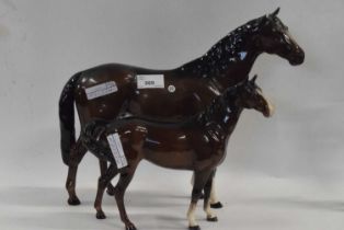 Large Beswick horse together with a smaller example (chip to ear of larger example), tallest 30cm