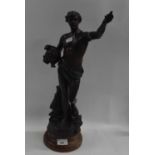 A Spelter model of a classical figure on circular wooden base, 50cm high