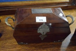 A Victorian mahogany sarcophagus formed tea caddy with silver plated mounts and a presentation