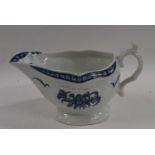 A Worcester porcelain sauce boat with blue and white printed design (crack to rim)