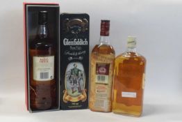 Three bottles of Scotch whisky, to include a Ballantine's, One Quart; The Famous Grouse, 1l; and a