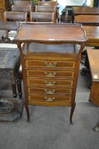 A late 19th or early 20th Century music cabinet reputedly manufactured for Liberty, mahogany tray