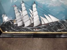 A large 19th Century diarama of a three masted ship and others on a stormy sea set into an