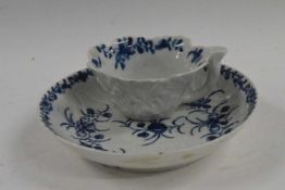 Worcester porcelain saucer with floral designs, circa 1770 with a small Worcester moulded butter