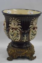 A 19th Century Maiolica style jardiniere, probably French, on metal mask head mounts