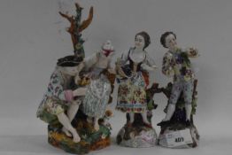 A group of continental porcelain figurines, late 19th Century including a group of man and woman and