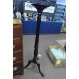 An early 20th Century mahogany torchair plant stand on tripod base, 140cm high
