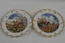 A pair of Royal Crown Derby plates with hand painted hunting scenes, signed by Scott within shaped