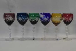 A group of six wine glasses or hock glasses, probably Polish lead crystal, the coloured bowls