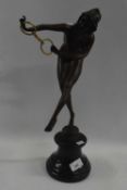 A Spelter model of an Art Deco dancer, reproduction, on simulated black marble base, 46cm high