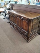 A large Georgian oak mule chest with later conversion to form cupboards at both ends, lid now sealed