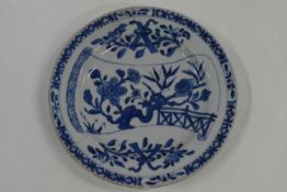 An 18th Century Chinese porcelain plate (a/f), 22cm diameter