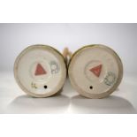 A pair of 20th Century Royal Dux ladies model as water carriers, 27cm high