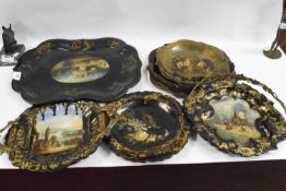Collection of Victorian papier mache wares to include a serving tray, four dishes with looped