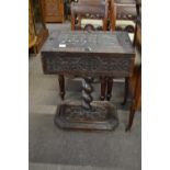 19th Century Gothic oak pedestal teapoy, rectangular hinged top with carved decoration raised on a