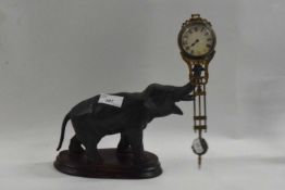 A small spelter mystery clock in the form of an elephant. Movement is siezed up.  One hand and glass