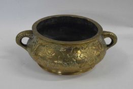 A Chinese brass censer with decoration of Chinese warriors with loop handles and apocryphal Xuande