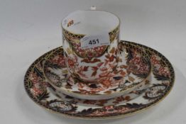 A Royal Crown Derby breakfast cup and saucer with side plate with Imari design