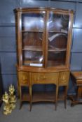 Edwardian serpentine formed combination mahogany display cabinet and secretaire, the serpentine