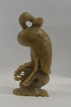 A soap stone carving of a pelican, 26cm high