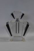 A large Art Deco heavy glass scent bottle with stopper in design of clear glass and black coloured