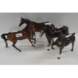 Group of four Beswick horses (one a/f)