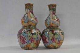 A pair of 19th Century Cantonese porcelain vases of double gourd shape with famille rose