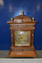 An early 20th Century continental Winterhalder and Hoffmeier mantel clock set in an architectural