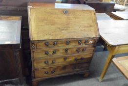 George III mahogany bureau of typical form with drop down front, fitted interior, four drawers and