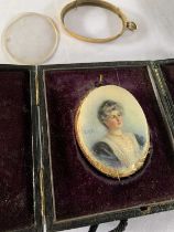 Oval portrait miniature, circa early 20th century, hand painted on bone, initialed 'E.M.S.', loosely