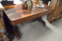 Mid 19th Century rosewood centre or library table of rectangular form raised on turned columns