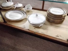 An early 20th Century part dinner service including serving tureens, gravy boat, large platters